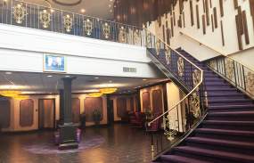 The curving staircase in the lobby of the Royal Regency.