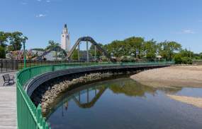 A view of Playland Park from the boardwalk with a rollercoaster.