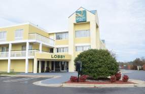 Exterior of Quality Inn Rocky Mount, showing the main entrance, hotel building, and Quality Inn sign.