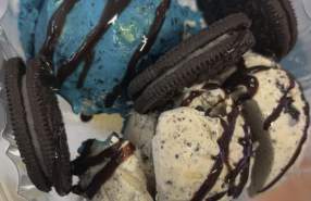Ice cream sundae with blue and cookies-and-cream ice cream, chocolate drizzle, and Oreo cookies at Scoops on Main St. in Rocky Mount, NC.