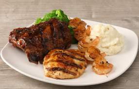 Grilled steak, chicken and shrimp served with mashed potatoes and broccoli.