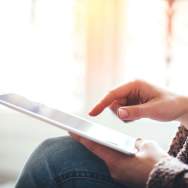 A person scrolling on a tablet