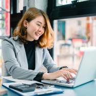 Woman at desk working on a laptop