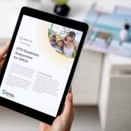 A person holds a tablet open to the DTN Readiness Assessment for DMOs.