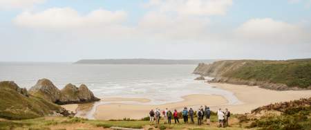 A group of 55+ individuals walking in Gower
