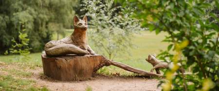 A wood statue of a fox in Singleton Park