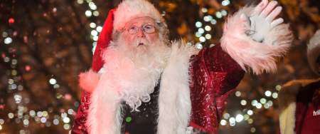 Father Christmas waving from his sleigh in the Swansea Christmas Parade