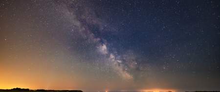Three cliffs coastline at night with sky full of stars