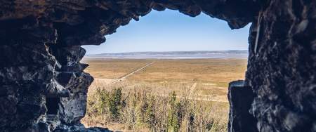 View of Loughor Estuary through a stone window.