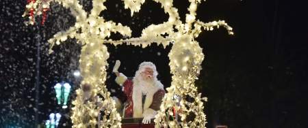 Father Christmas riding his sleigh in the Swansea Christmas Parade