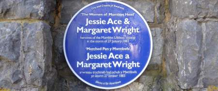 blue plaque placed onto stone wall