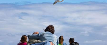 Couple hugging while watching the wales airshow