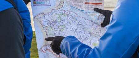 Hikers pointing at a map