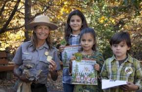 Ranger posing with junior rangers for the Big Thicket Junior Ranger Day