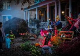 Kids trick-or-treating at a spooky house