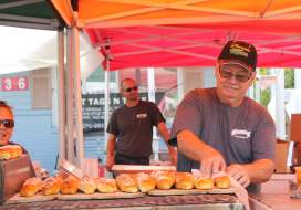 Man serving homemade pretzel rolls at the Catoctin Colorfest