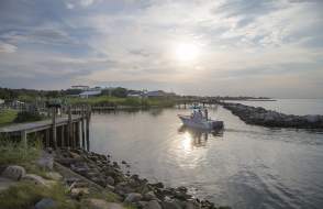 Small boat coasting on the waters of Dauphin Island