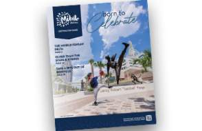 Cover of the 2026 Destination Guide - a boy posing like he is throwing a baseball in front of a statue of Satchel Paige