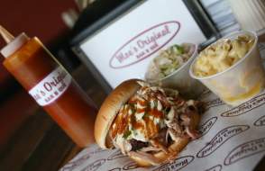 BBQ sandwich, macaroni and cheese, cole slaw and bbq sauce