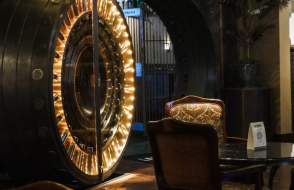 Lighted vault door, table and chairs