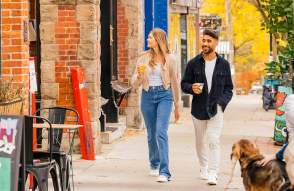 Couple walking down sidewalk in downtown Ann Arbor