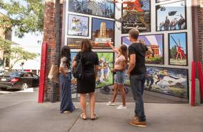 Group of professional looking at downtwon mural