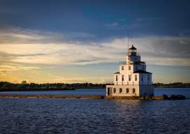 Manitowoc Breakwater Lighthouse at sunset by Bill Chizek