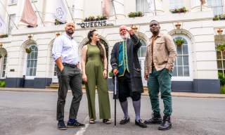 Group tour Cheltenham. Group stood outside the Queens Hotel Cheltenham with tour guide Phil from Cheltenham Promenaders.