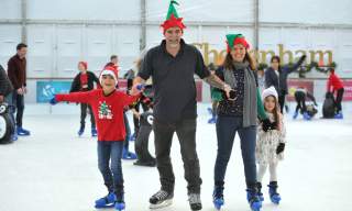 A family dressed up, ice skating at Cheltenham Ice Rink.