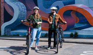 Visitors riding bikes in Cheltenham.