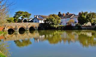View over the water of Town Bridge and houses