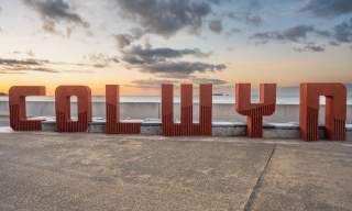 Colwyn Bay sign sitting on the promenade
