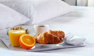 breakfast on a bed, white linen