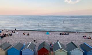 view of beach huts on budleigh beach