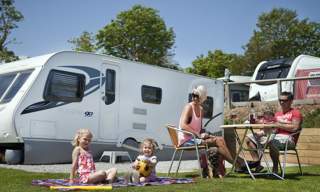 family outside caravans
