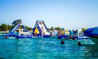 An inflatable assault course on a lake