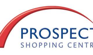 Prospect Shopping Centre logo featuring a red curved arch above bold blue text reading “Prospect Shopping Centre” on a white background.