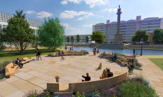People sat in a circluar seating area next to one of Queens Gardens ponds. With Hull College overlooking the space.