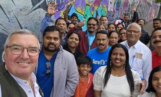 Visitors and tour guide posing for a photograph
