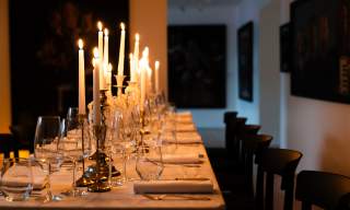 Candlelit table set for a supper club evening in Northern Ireland.