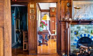A beautifully decorated hallway can be seen, along with a glimpse of a living room in Cairn Bay Lodge