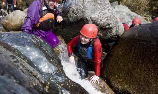 A young boy Bouldering at Bloody Bridge in Newcastle, County Down