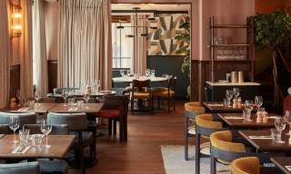 Empty restaurant with tables and chairs at the Townhouse Coppa Club Guildford