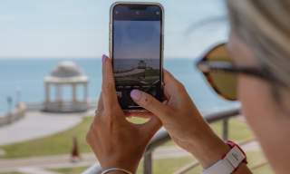 Taking a photo of the seafront from de la warr pavilion
