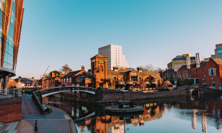 Birmingham's canals diverge at a crossing, heading both to the right (toward the ICC) and the left (toward the Jewelry Quarter)