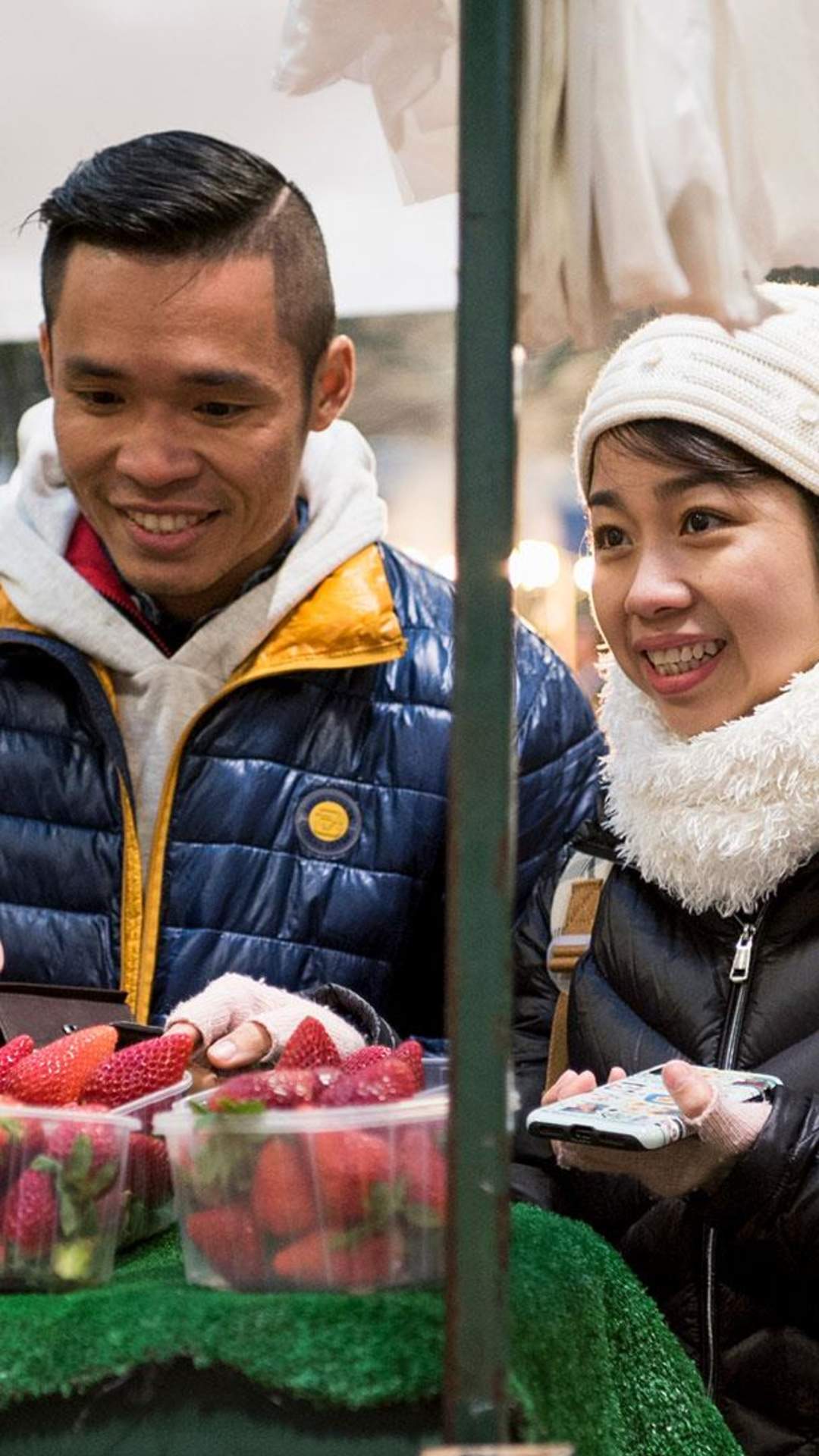 International visitors sampling the fruit stalls at St George's Market.