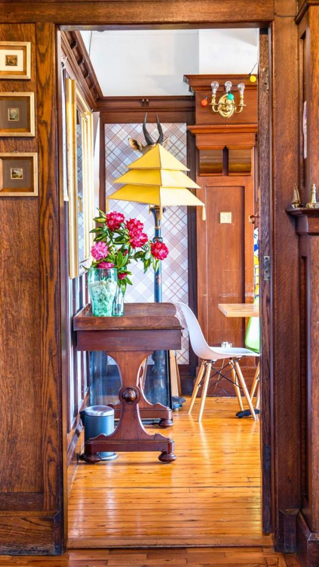 A beautifully decorated hallway can be seen, along with a glimpse of a living room in Cairn Bay Lodge