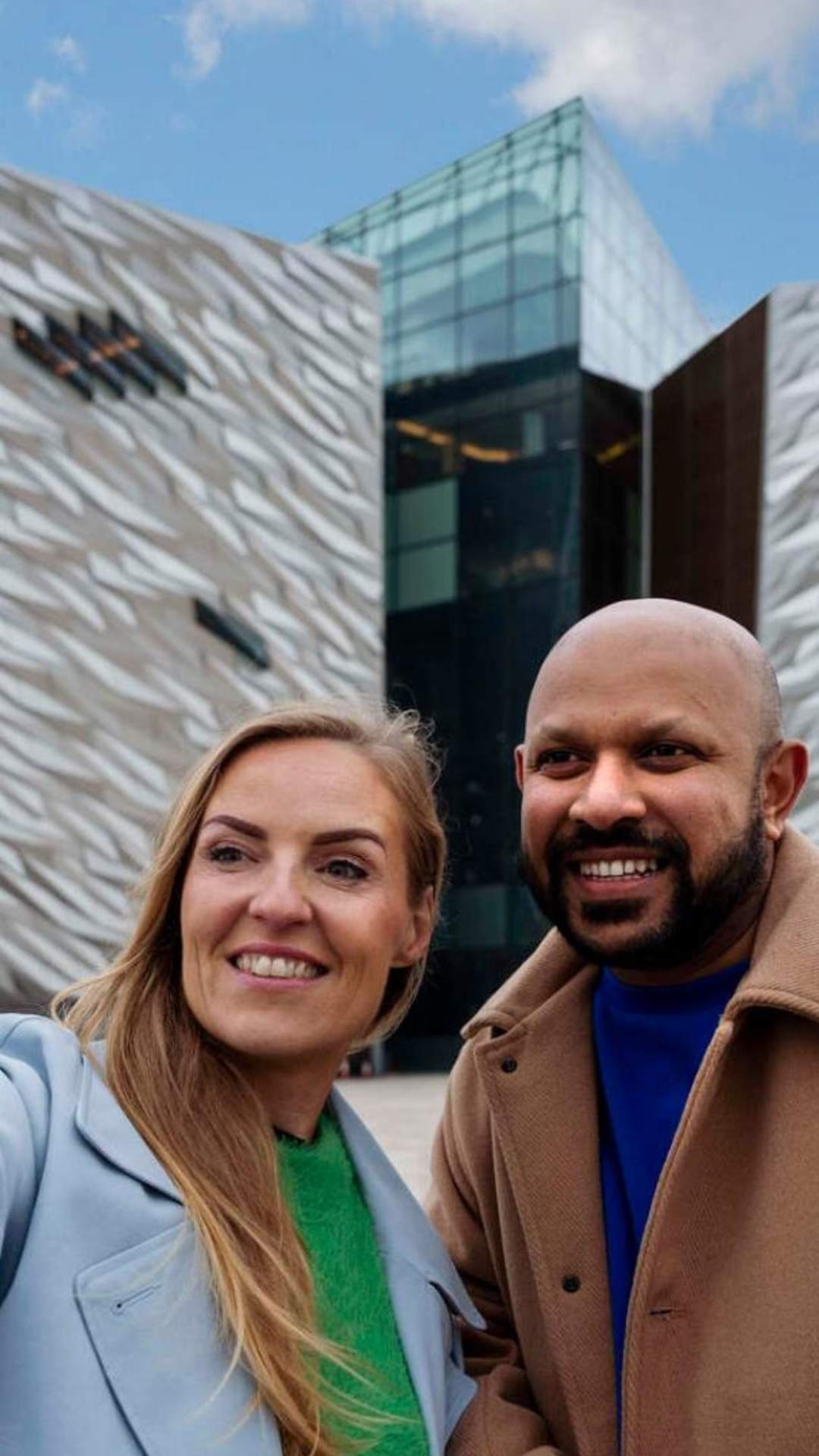 Couple taking a selfie in front of Titanic Belfast