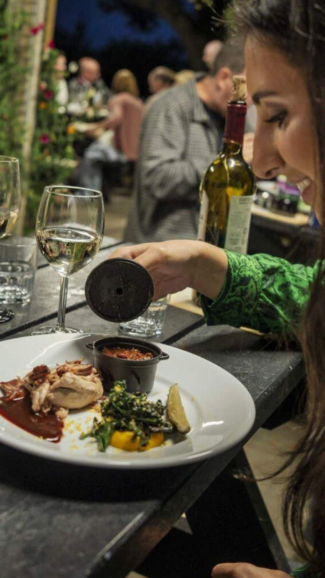 Couple enjoying a meal and a glass of wine at Slemish Supper Club, Ballymena