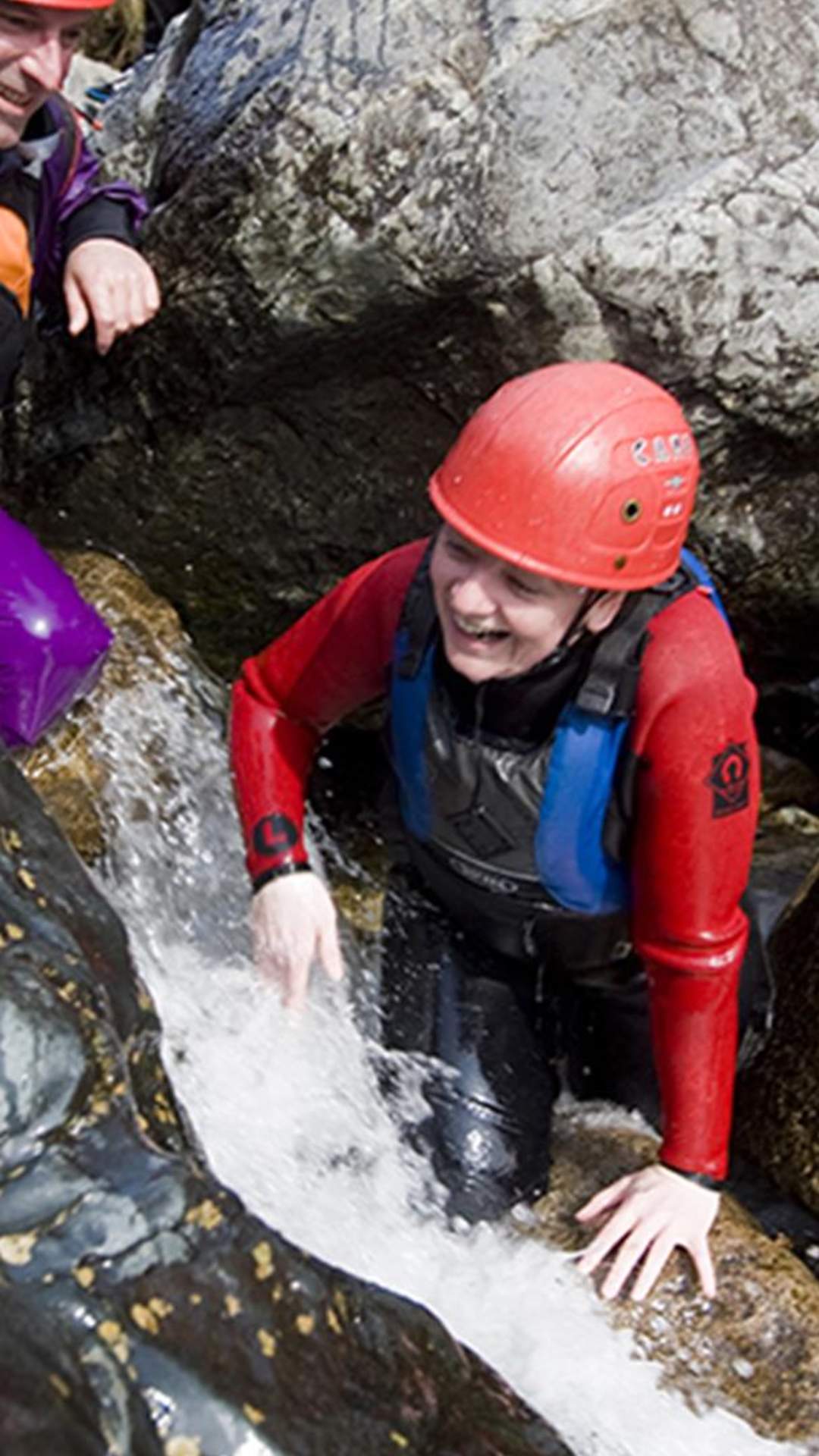 A young boy Bouldering at Bloody Bridge in Newcastle, County Down